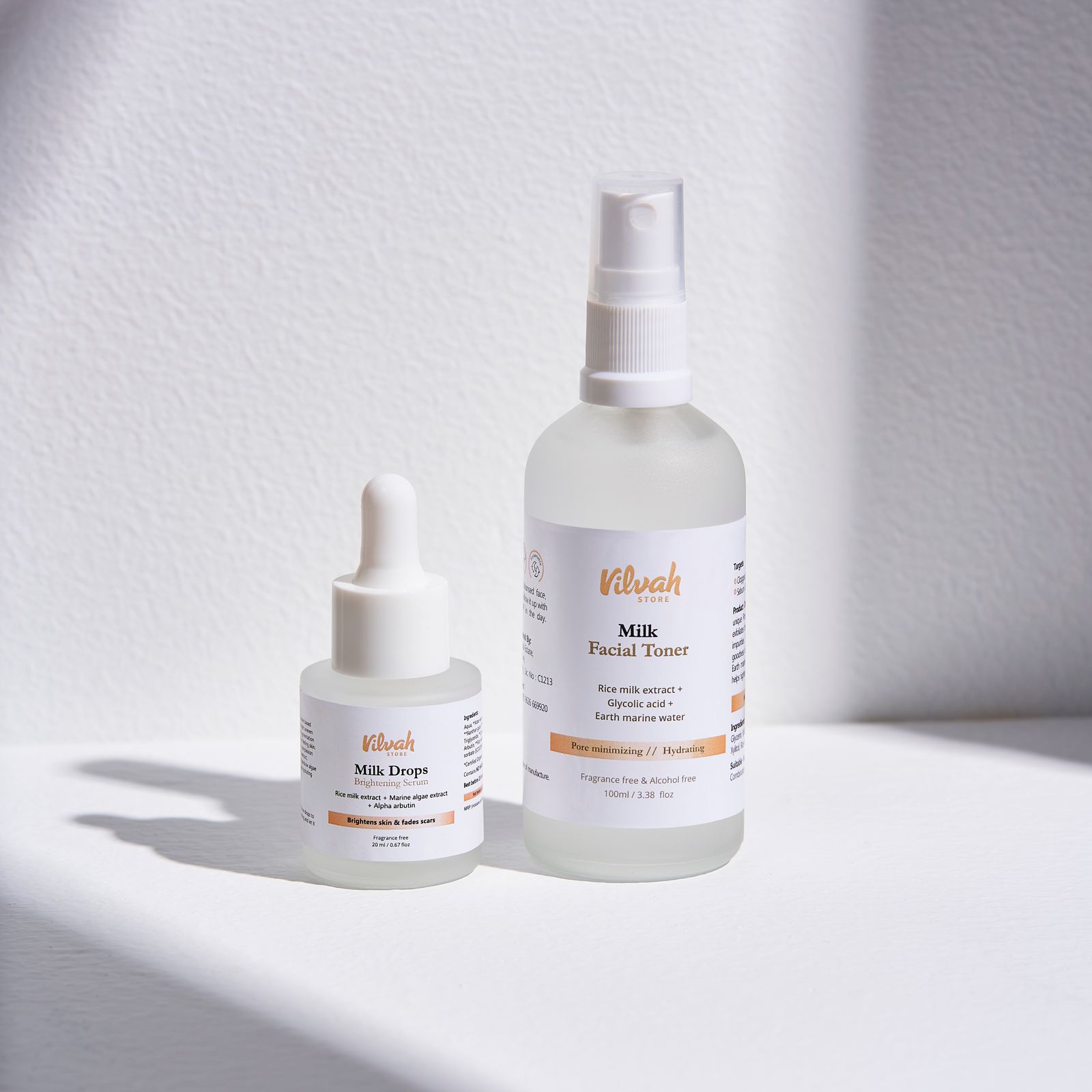Two minimalist serum and toner bottles