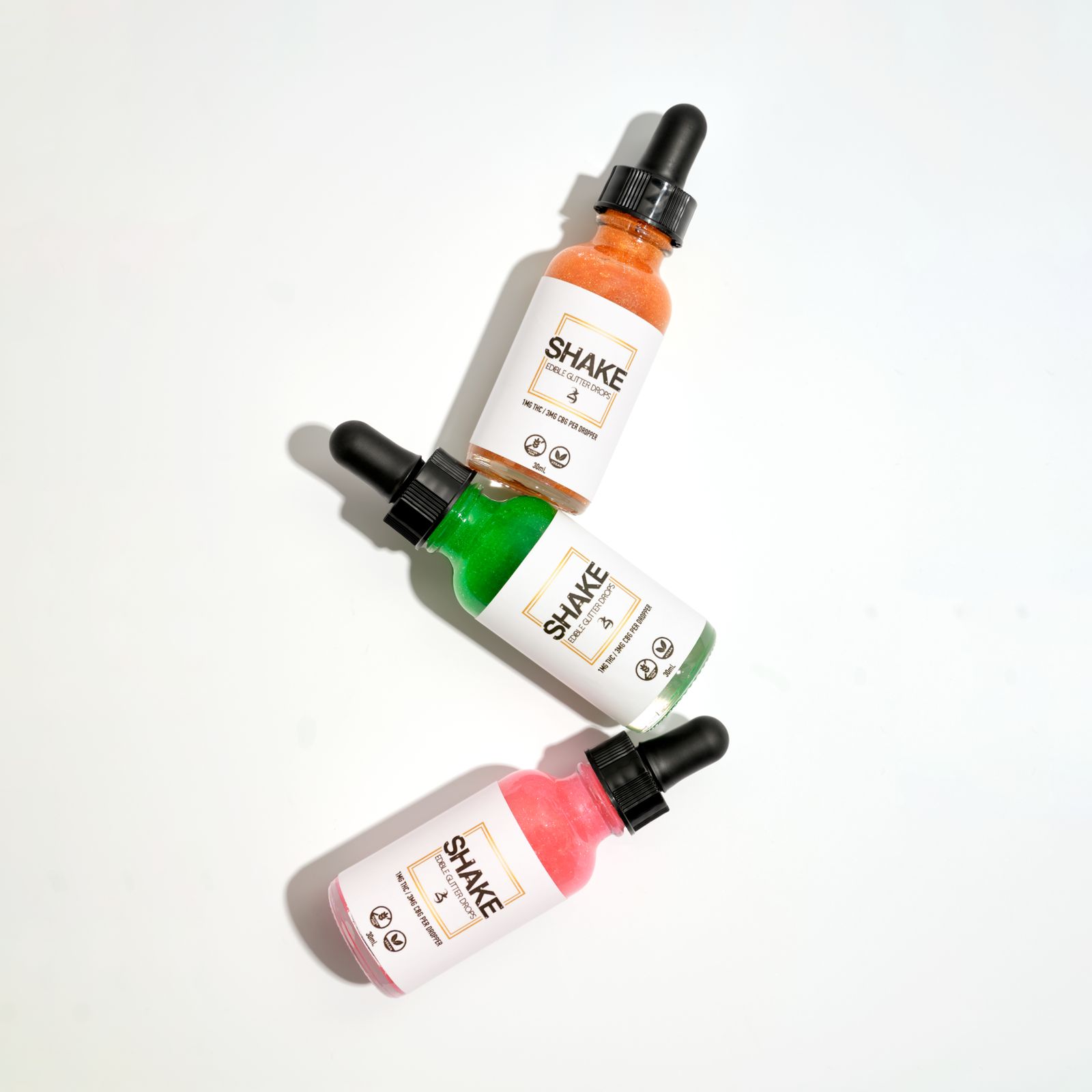 Dropper bottles of oil on a white background